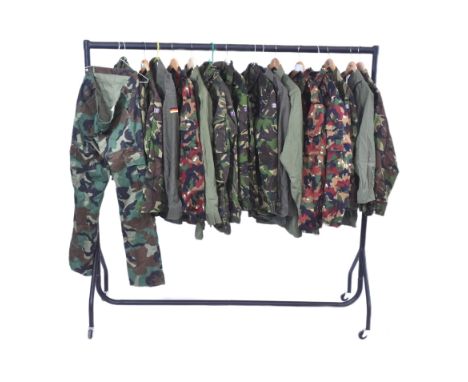 A collection of x16 post war&nbsp;British Army camo uniform shirts and jackets along with one pair of combat trousers (size 3