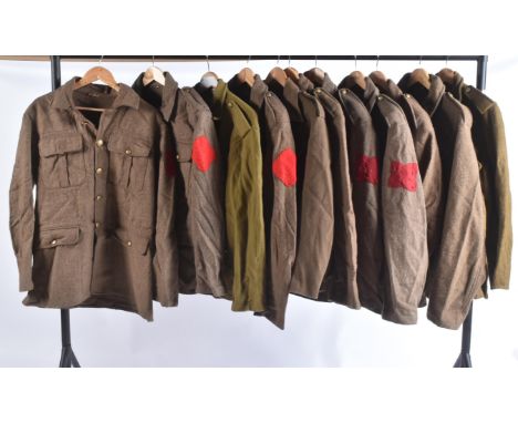 A collection of re-enactment WWI First World War British Army Officer / General Service Corps uniform tunics. Khaki with fron