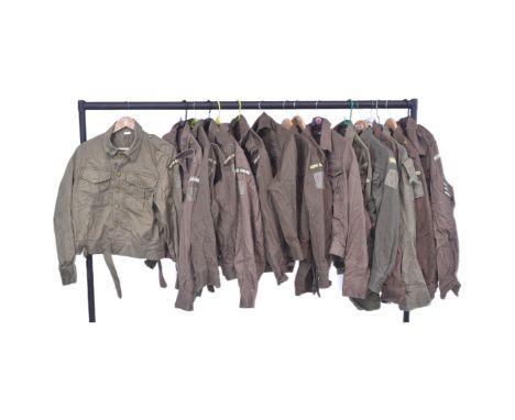 A collection of reenactment Home Guard uniform tunics with Dads Army CP 1 patches to the left sleeve. Some tunics original Se