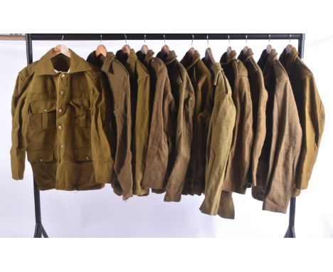 A collection of re-enactment WWI First World War British Army Officer / General Service Corps uniform tunics. Khaki with fron