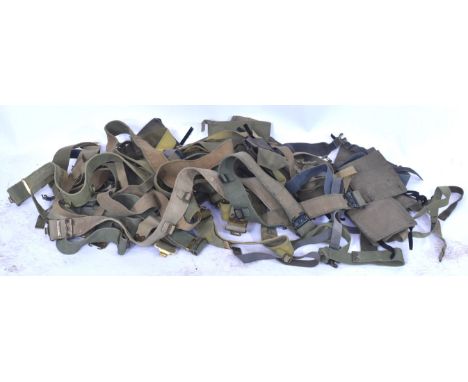 A large collection of assorted WWII Second World War and post war British Army webbing belts.