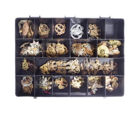 A large collection of assorted British Military cap badges to include; The Essex Regiment, Lancashire Fusiliers, Royal Artill