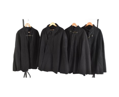 A collection of x4 vintage British Police uniform woollen night cape / cloak with chain fastenings.