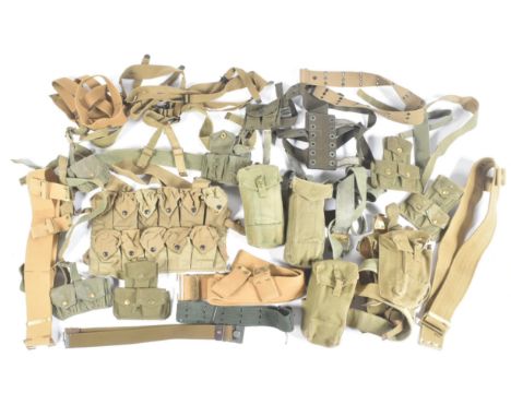 A large collection of British Military webbing belts and pouches / water canteen holders. Largely post war examples, many wit