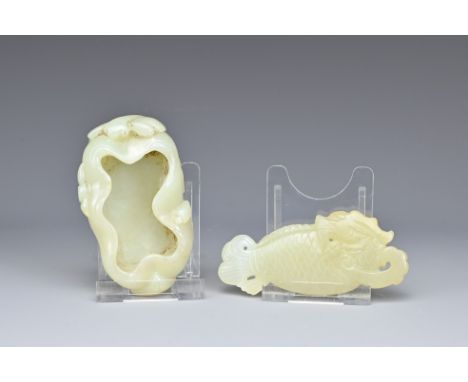 TWO CHINESE PALE CELADON JADE ITEMS. To include a lotus leaf brush washer with dragon fly and leafy stems in relief. Together