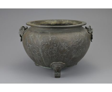A LARGE JAPANESE BRONZE TRIPOD CENSER, 19TH CENTURY, MEIJI PERIOD. Rounded body with everted rim on three elephant feet. Two 