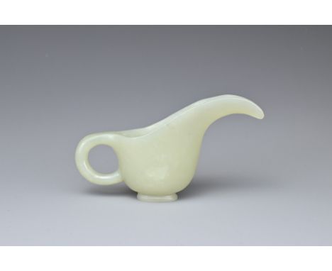 A CHINESE PALE CELADON JADE CUP. Of slender form with a looped handle and curved spout. 10.5cm length. Overall good condition