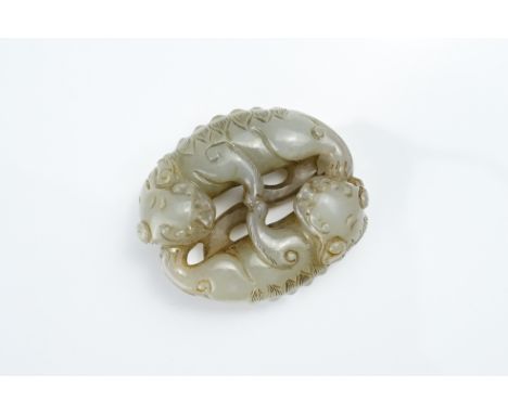 A CHINESE CELADON JADE LION GROUP. Carved and pierced with two lions playing. 5.5cm length.Overall good condition. 
