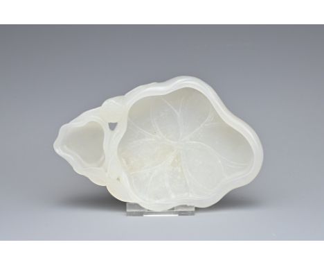 A CHINESE WHITE JADE LOTUS BRUSH WASHER. In the form of a lotus leaf with pod and leafy stems. 13cm length. Overall good cond