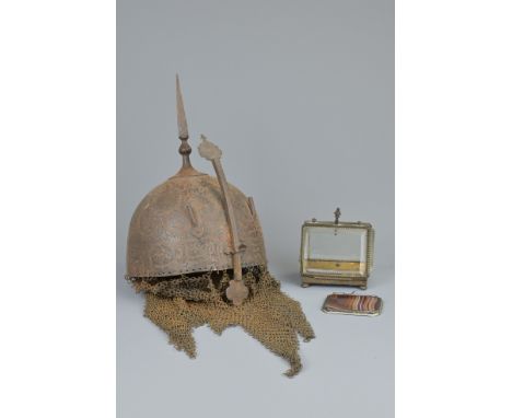 A PERSIAN KULAH KHUD METAL HELMET. With tall central spike and adjustable nose guard between two plume holders, decorated wit
