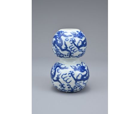 A CHINESE BLUE AND WHITE PORCELAIN DOUBLE-GOURD DRAGON VASE, MARK AND PERIOD OF JIAJING (1522-1566). With two bulb like secti