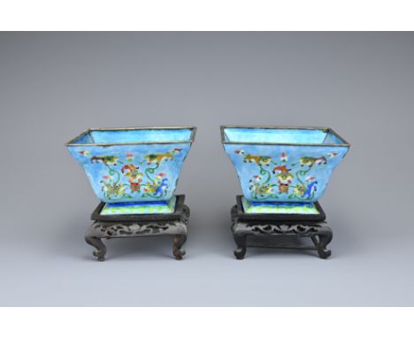 A PAIR OF CHINESE ENAMELLED COPPER SQUARE BOWLS ON STANDS, EARLY 20TH CENTURY. Each light blue ground with polychrome enamel 