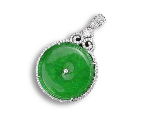 AN 18KT WHITE GOLD, DIAMOND AND JADEITE CIRCULAR SHAPED PENDANT. Centred with a diamond, within white gold and diamond settin