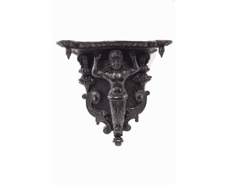 A carved oak and lime wood wall bracket, possibly from a ship, 49cm high