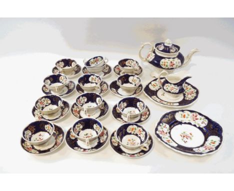 A 19th century Gaudy Welsh tea service, comprising a teapot, milk jug, thirteen cups, twelve saucers and a sandwich plate