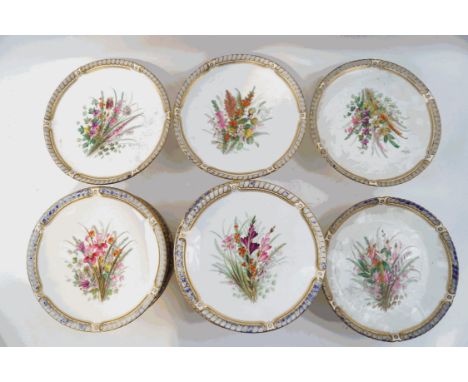 A 19th century Worcester porcelain dessert service painted in enamels with bouquets of wild flowers, within moulded blue and 