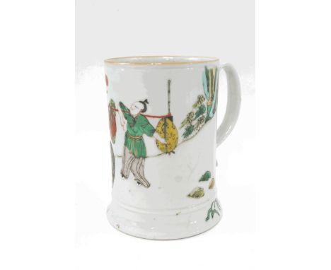 A Chinese Kangshi famille vert tankard, with enamel decoration of   a figure upon horseback and another carrying loads, 16cm 