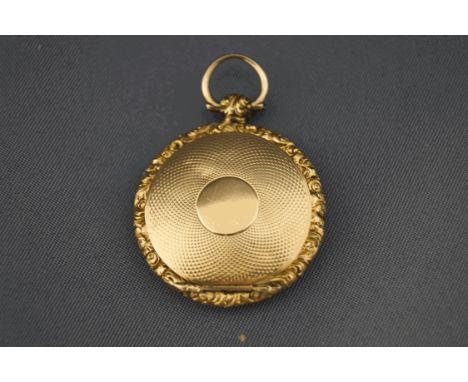 A Victorian gold vinaigrette pendant, unmarked, circular with engine turned decoration, 2.7 cm diameter, 9.2 g ross