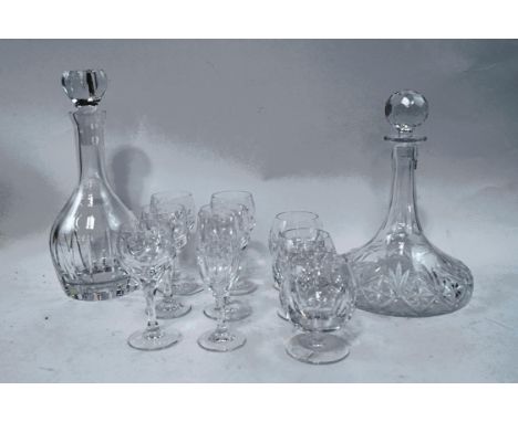 Nine Royal Doulton crystal drinking glasses, a Waterford crystal decanter and a ship's decanter