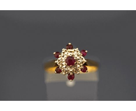 An 18 carat gold ruby and single cut diamond cluster ring, finger size O, 3.5 g gross