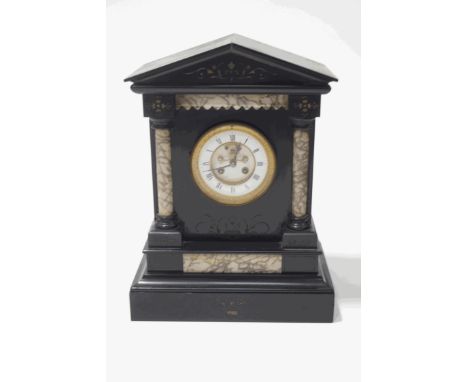 A Victorian black marble mantel clock of architectural form, the enamel dial with Roman numerals, encircling a visible escape