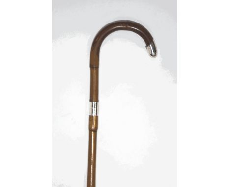 A walking stick with silver collar and tip, London 1911