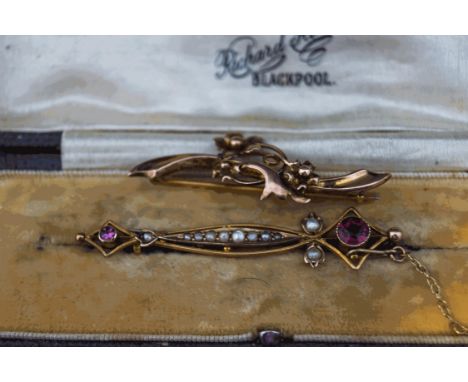 An Edwardian garnet and split pearl brooch, stamped '9ct', cased; with a 9 carat gold bar brooch of a similar vintage; 4.2g g
