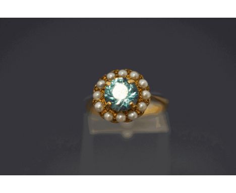 A 9 carat gold blue zircon and cultured pearl cluster ring, finger size M, 3.2 g gross, cased