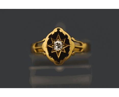 A late Victorian diamond set ring, stamped '18ct', the navette shape head with traces of black enamel, star set with an old b