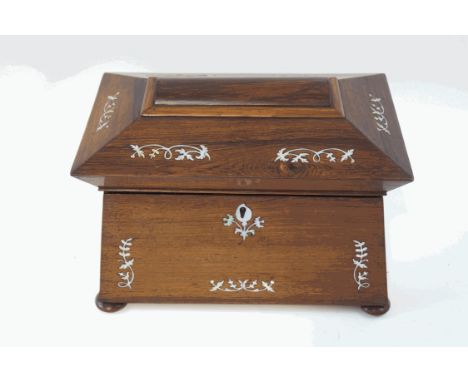 A 19th century rosewood and mother of pearl inlaid tea caddy, of sarcophagus form, the interior with two lidded compartments,