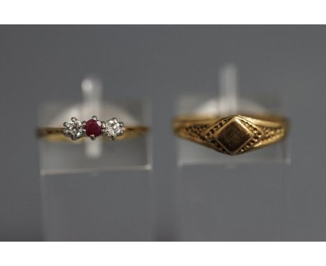 A 9 carat three stone ruby and cubic zirconia ring, finger size J1/2; and a 9 carat gold signet ring; 3.1 g gross