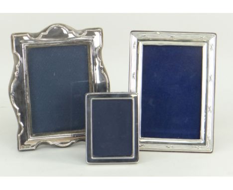 THREE SILVER PORTRAIT PHOTOGRAPH FRAMES, one small, two medium (3)