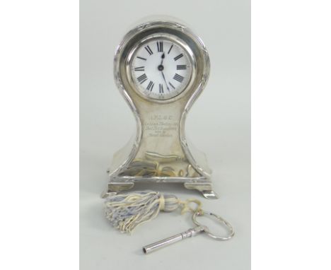 EDWARD VII SILVER BALLOON SHAPED CLOCK raised on four played feet, having Roman numeral chapter ring, engraved to front AFLGC