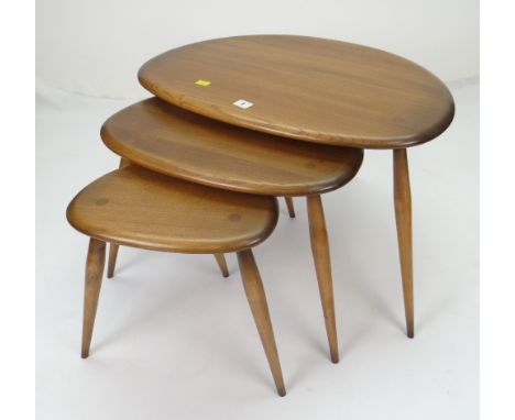 NEST OF ERCOL PEBBLE OCCASIONAL TABLES, largest 65cms wide