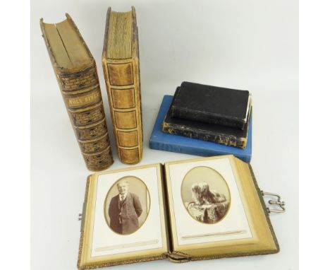TWO VICTORIAN PHOTOGRAPH ALBUMS, tooled leather embossed covers and gilt metal clasps, containing family photographs and pets