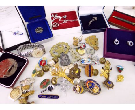 ASSORTED METAL &amp; ENAMEL BADGES including military and railway items, and a wristwatch by Accurist