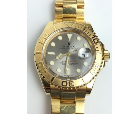 A GENTLEMANS 18K GOLD ROLEX OYSTER PERPETUAL DATE YACHT MASTER WRIST WATCH 
 •Grey pearl dial with gold numerical dots/ baton