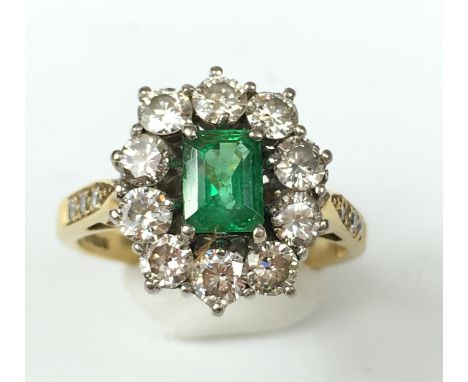 18CT GOLD DIAMOND AND EMERALD CLUSTER RING.
An 18ct gold Diamond and Emerald cluster ring set with fine step cut Emerald esti