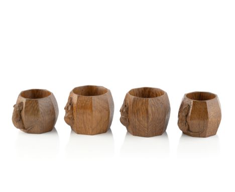 Robert Thompson of Kilburn (1876-1955)A set of four Mouseman napkin rings, circa 1970oakcarved mouse signatureeach 5.5cm high