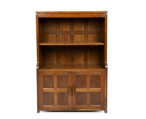 Attributed to Robert 'Mouseman' Thompson of Kilburn (1876-1955) or Sid PollardAn early open-shelved bookcaseoak and burr oak,