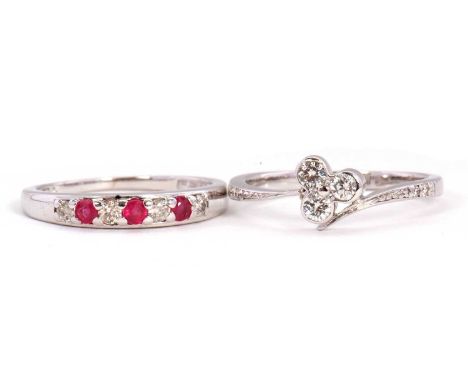 An 18KT ruby and diamond ring and a diamond ring: the alternating seven stone diamond and ruby ring with lightly tapered shou