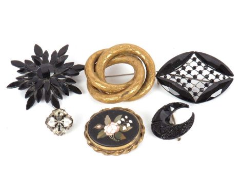 A mixed lot of brooches: to include an oval pietra dure brooch in gilt metal mount; a carved jade crescent brooch (a/f); two 