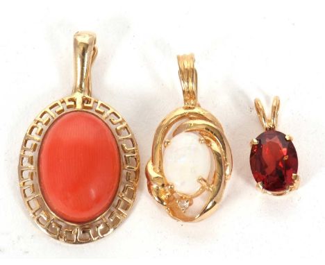Three gemset pendants: to include an oval coral pendant with Greek key style surround with fixed bale with hinged fastening, 