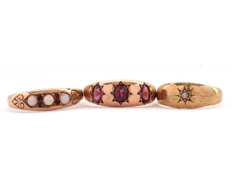 Three gemset gold rings: to include a 9ct three stone garnet ring hallmarked Chester 1905, size O-P, 3.0g; a 9ct single stone