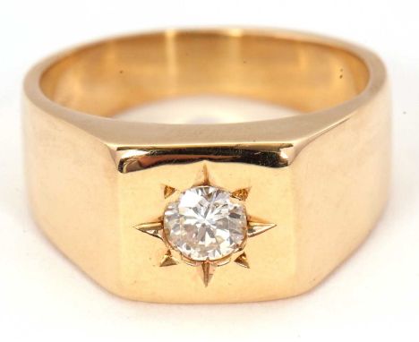 A gentleman's diamond ring, the gypsy set round brilliant cut diamond, estimated approx. 0.46cts, in a 1cm square plaque, wit