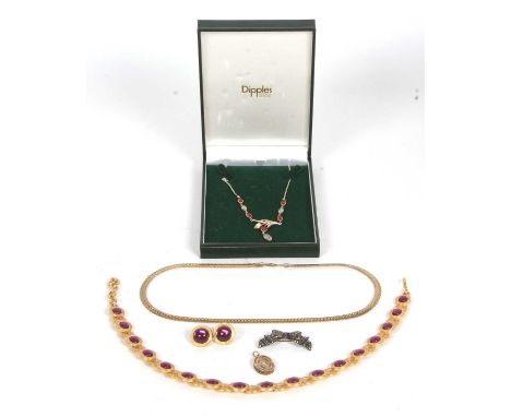 A mixed lot of jewellery: to include an amber and moonstone necklace stamped 925, a Monet purple glass necklace and matching 