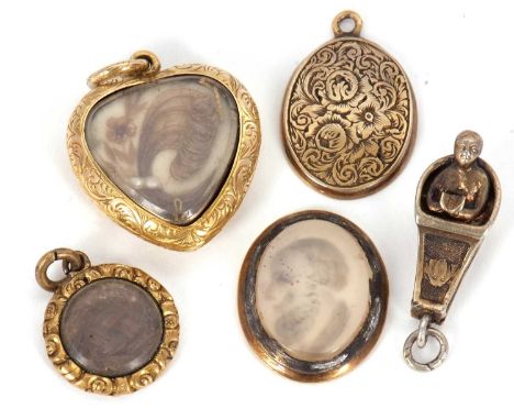 A small group of charms: to include a heart shape locket with glazed keepsake panel containing hairwork, 20mm wide; an oval h