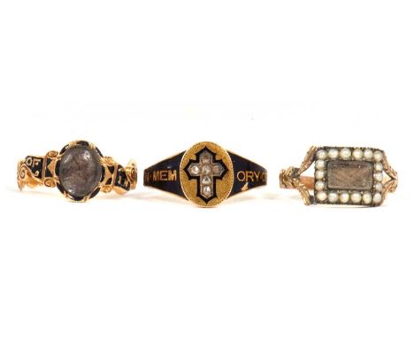 Three mourning rings: to include a Victorian ring set with a rose cut diamond cross and blue enamel 'In Memory Of', hallmarke