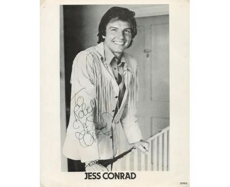 Jess Conrad signed 10x8 inch vintage black and white promo photo dedicated. Music Autograph. Good condition. All autographs a