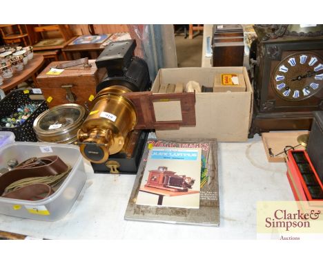An Optimus Magic Lantern, a box of slides, and screen and two Magic Lantern books etc.